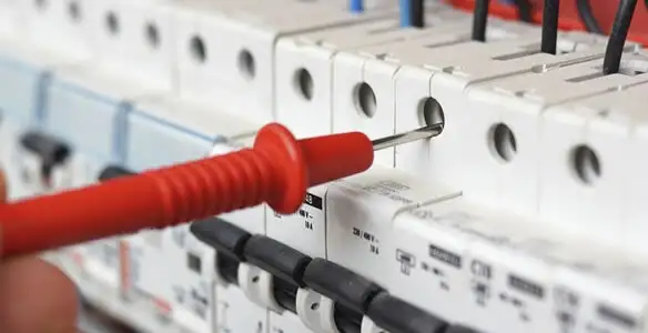 Electrical contractor testing circuit breakers during electrical repair in Chandler Heights, AZ