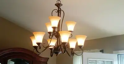 Classic ceiling chandelier installation with warm lighting in Mesa, AZ
