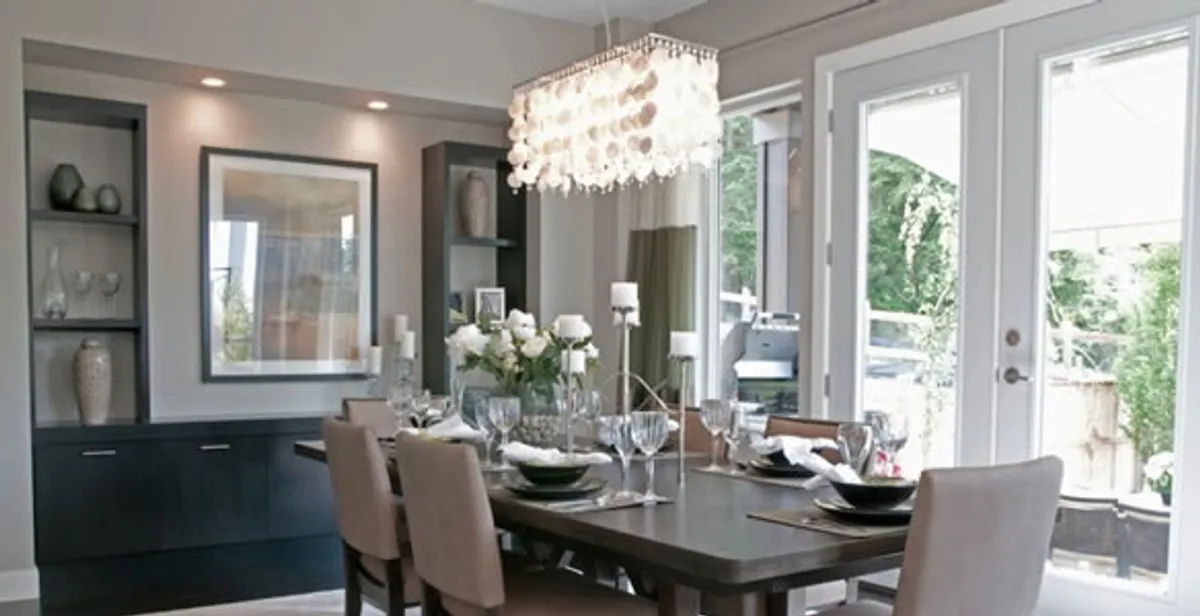 Elegant dining room chandelier installation above table in Mesa, AZ
