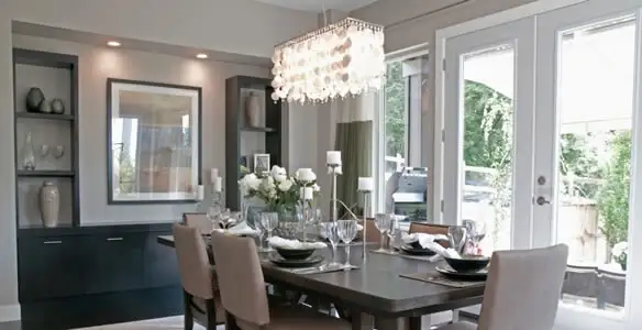 Elegant dining room chandelier installation above table in Mesa, AZ