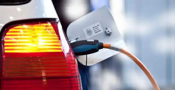 Electric car plugged into EV charger after professional installation in Mesa, AZ