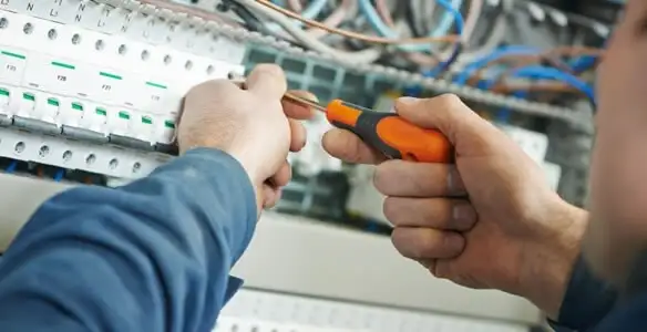 electrical service showing licensed electrician performing electrical panel maintenance and adjustments in Mesa, AZ