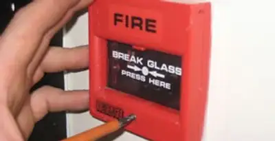 fire alarm installation service showing manual fire alarm pull station installed by licensed electricians in Mesa, AZ