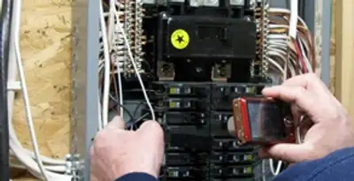 Home electrical inspection of circuit breaker panel by licensed electrician in Mesa, AZ