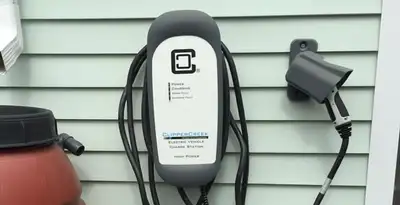 Outdoor electric vehicle charger installation on residential wall in Mesa, AZ