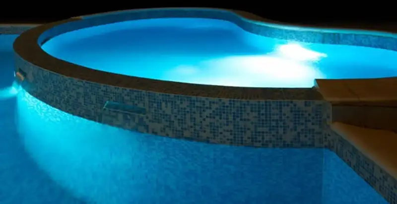 pool light installation and repair services highlighting illuminated pool interior lighting in Mesa, AZ