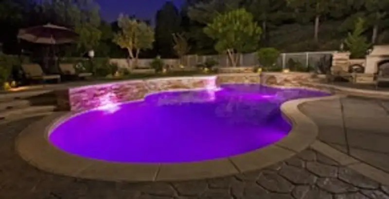 pool light installation and repair services illuminating a residential swimming pool in Mesa, AZ
