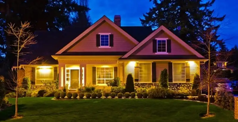 security light installation services illuminating a residential exterior at night in Mesa, AZ
